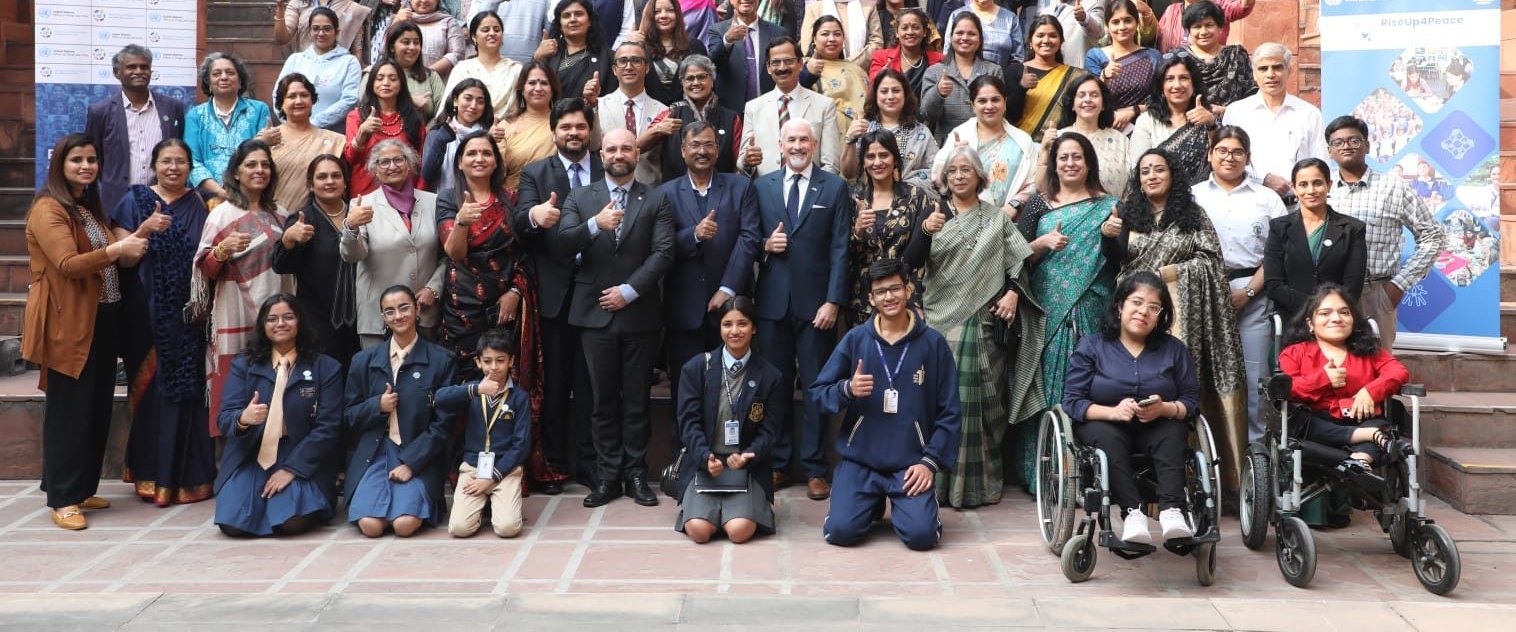 Participants at the NCERT and UNODC RiseUp4Peace education stakeholders&rsquo; dialogue in New Delhi &mdash; students, educators and officials standing together, with several wheelchair users among them at the front.